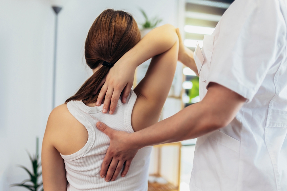 Teen,Girl,Having,Chiropractic,Back,Adjustment.,Osteopathy,,Physiotherapy,,Kinesiology.,Bad