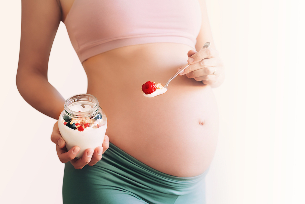 Nutrition,And,Wellbeing,During,Pregnancy.,Close-up,Pregnant,Belly,With,Healthy
